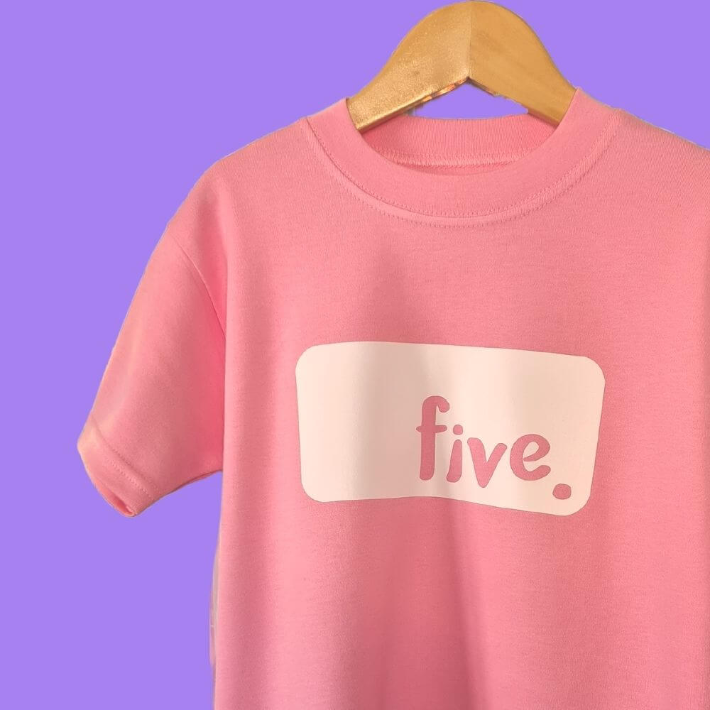 Pale Pink tshirt, white logo with text 'FIVE'. Personalised Birthday tshirt by The Joyful Rebel