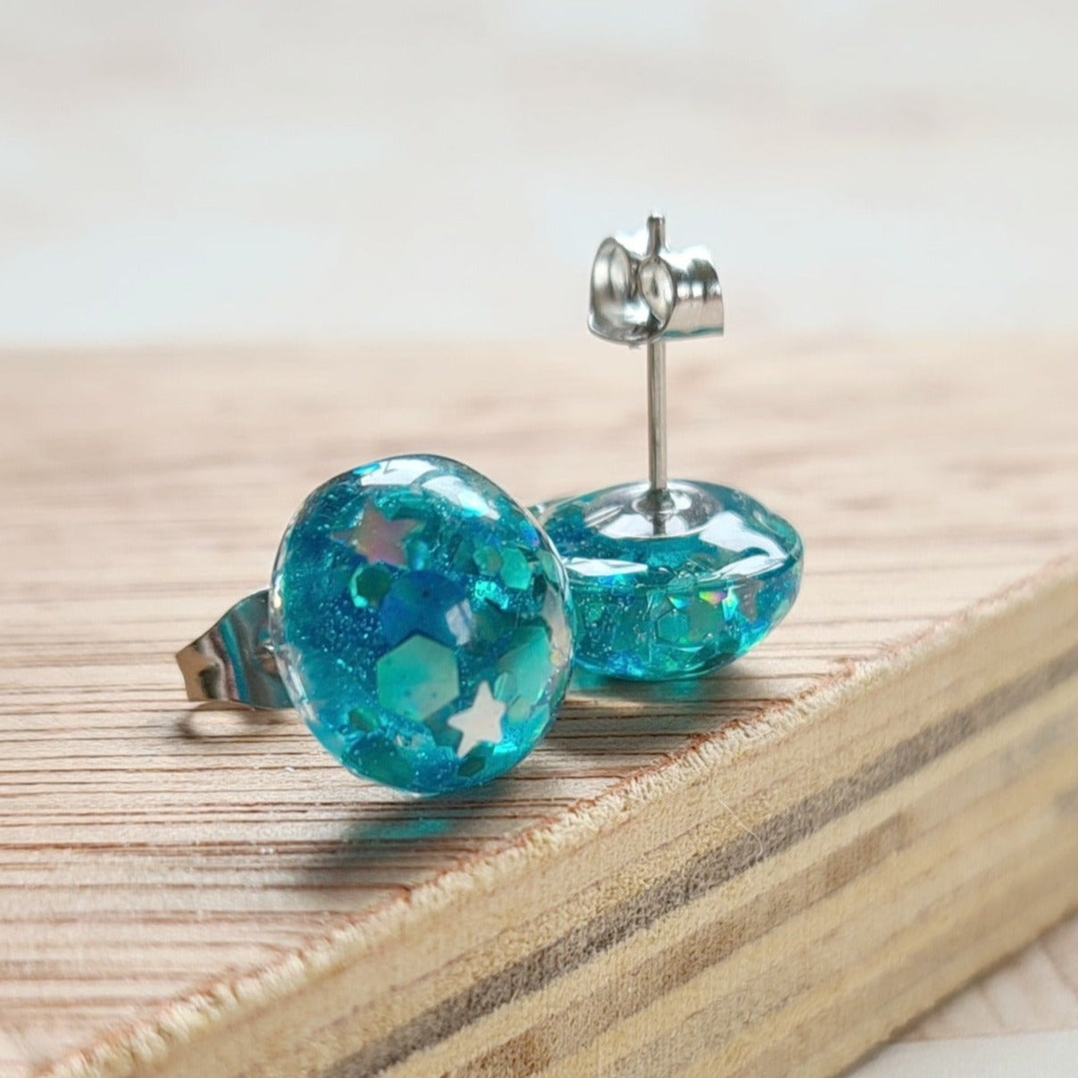 Shiny resin glitter turquoise with hexagon and star shapes 
