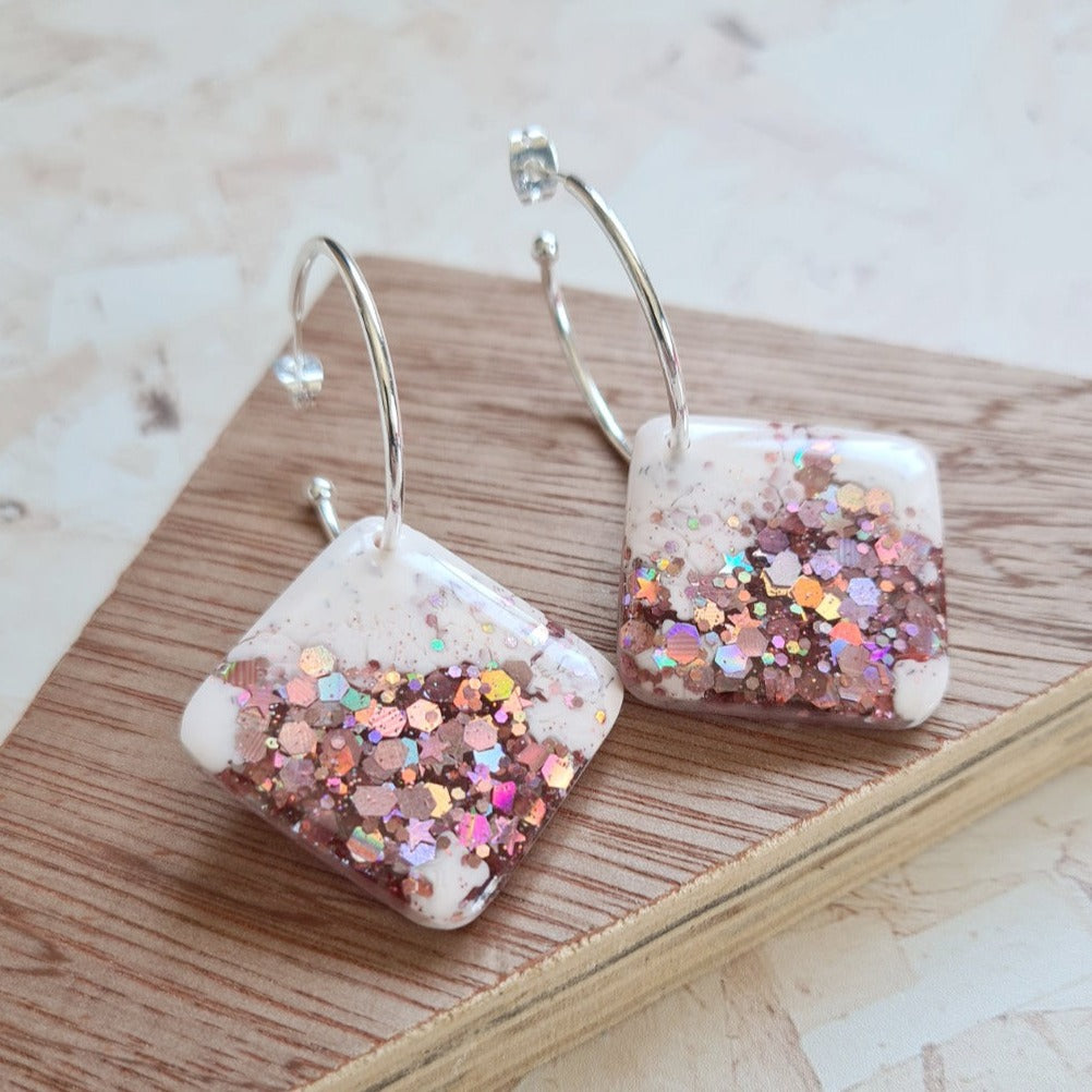 Pale pink with gold pink glitter resin tile on silver hoop - the joyful rebel
