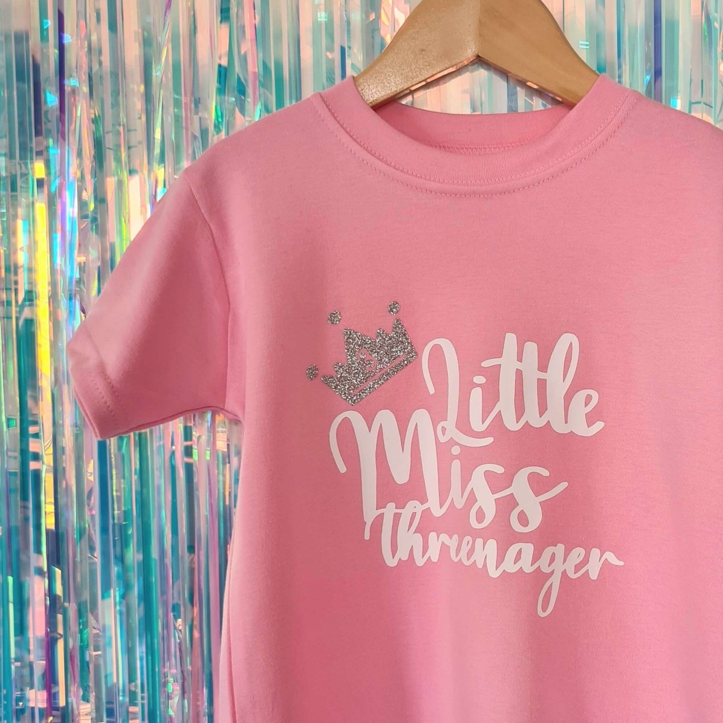 Pink kid's tshirt with white logo 'Little Miss Threenager' and silver glitter crown. T-shirt made by The Joyful Rebel