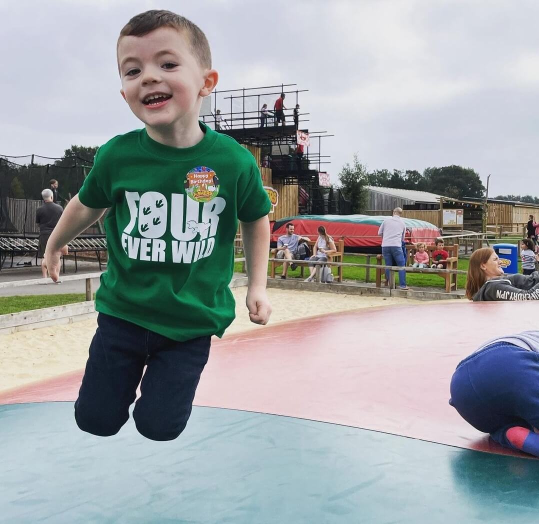 boy jumping on a trampoline with a 4th birthday tshirt - Four Ever Wild - The Joyful Rebel 