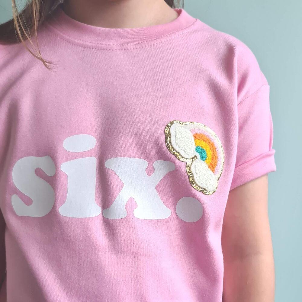 child wearing pale pink cotton birthday tshirt with the number 6 from The Joyful Rebel