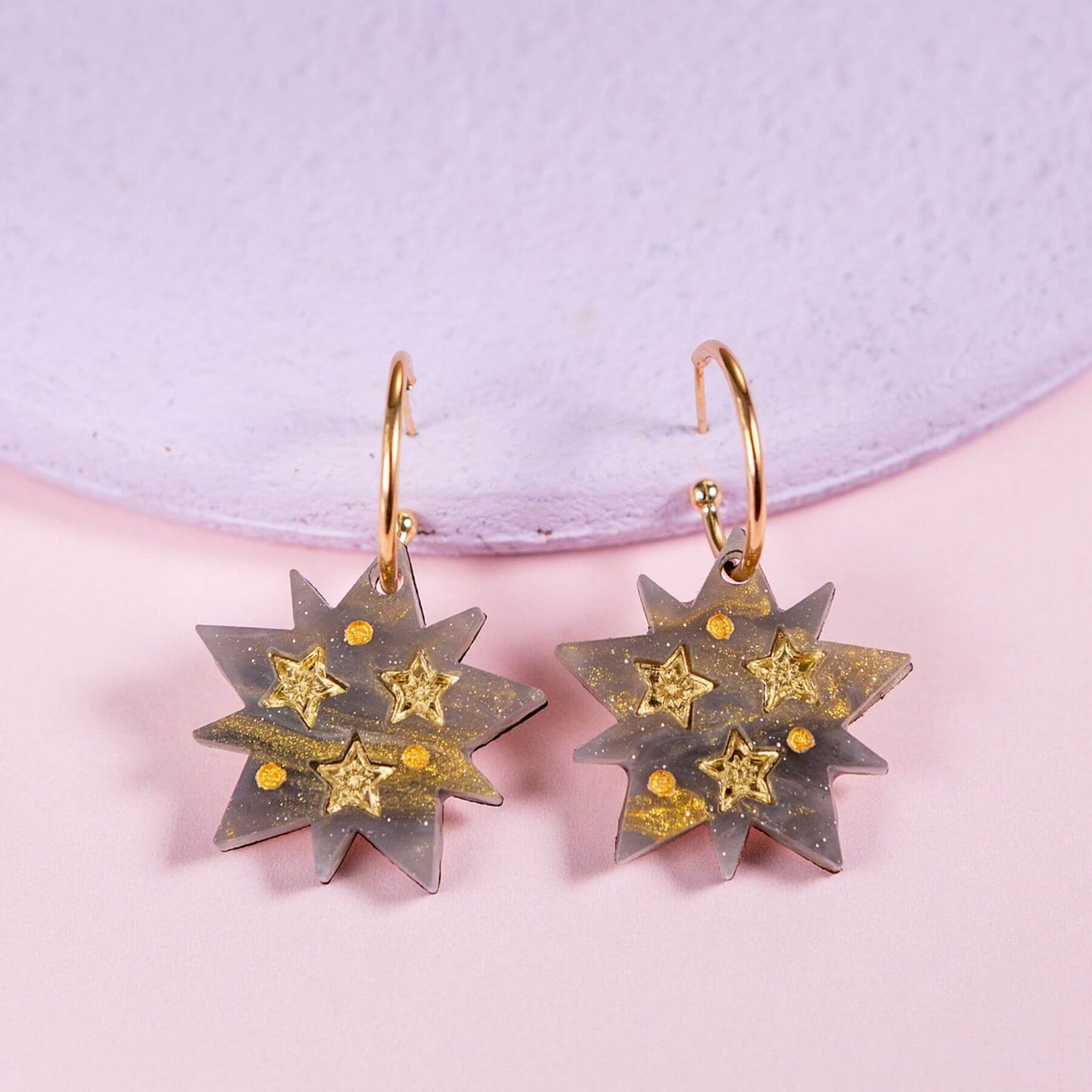 Handmade celestial star hoop earrings with shimmering resin star pendant