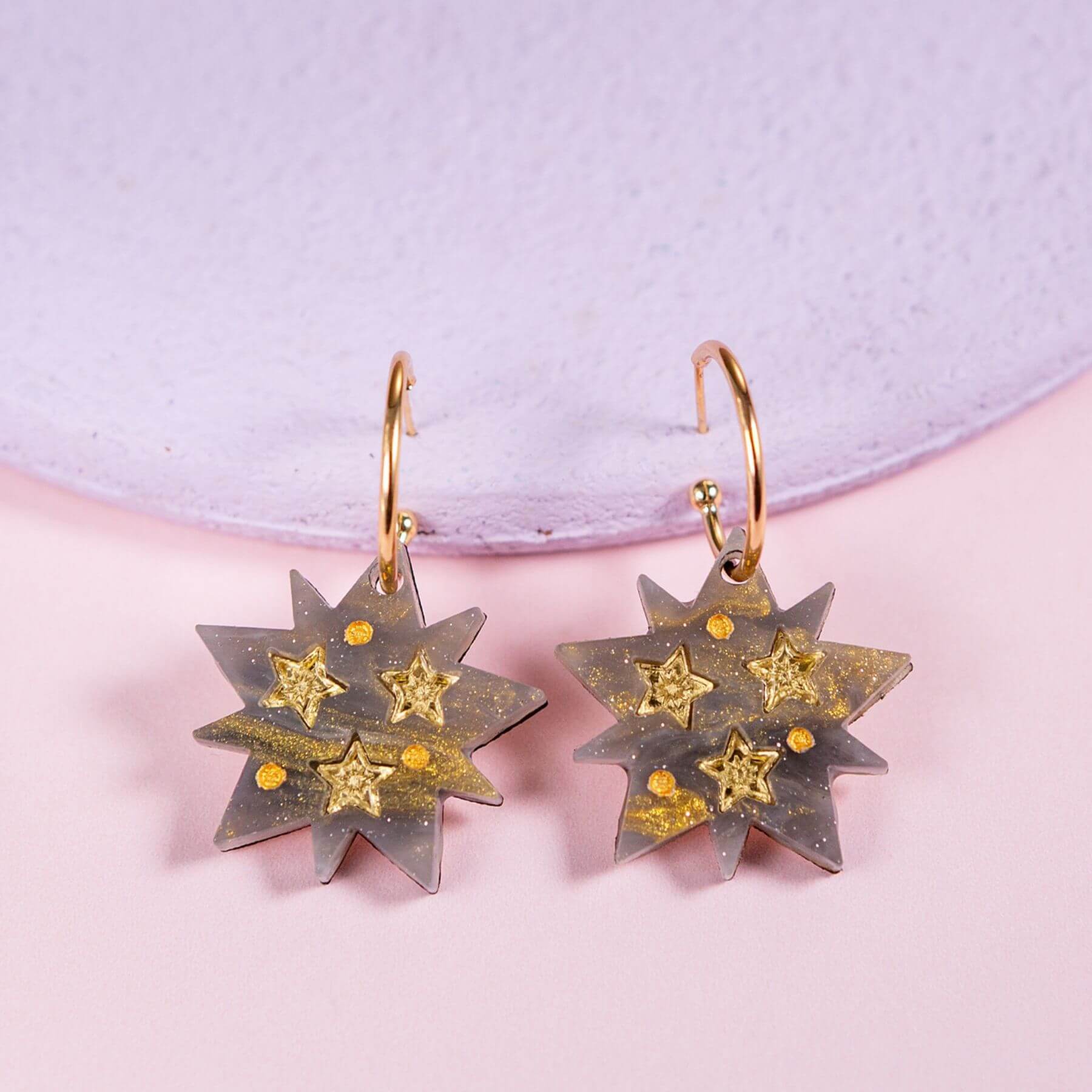 Handmade celestial star hoop earrings with shimmering resin star pendant