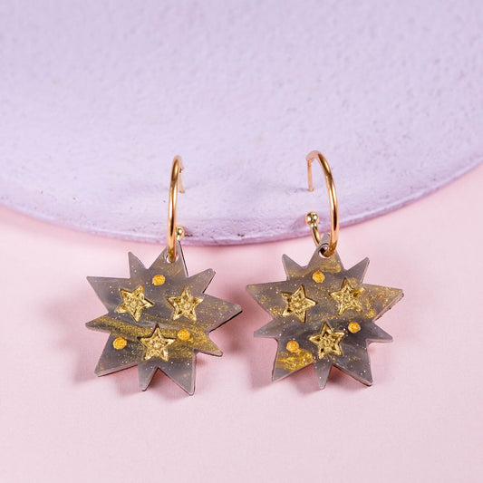 Handmade celestial star hoop earrings with shimmering resin star pendant