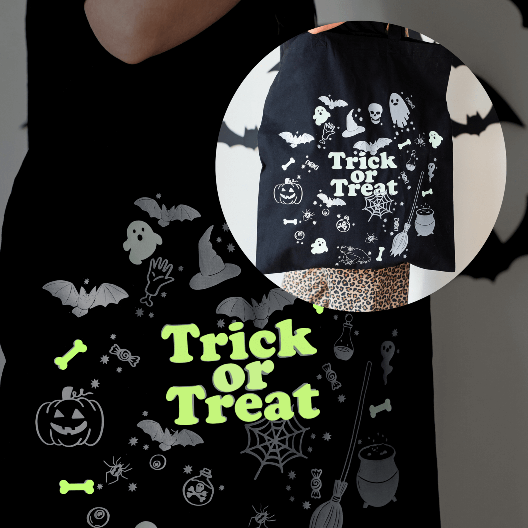 Black Halloween-themed bag with 'Trick or Treat' text and graphics glowing on a dark background.