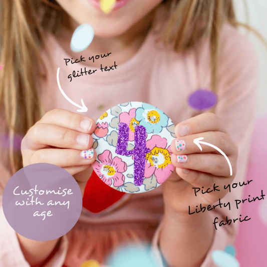 Custom Kids birthday badge with colourful flower print and purple glitter numbers