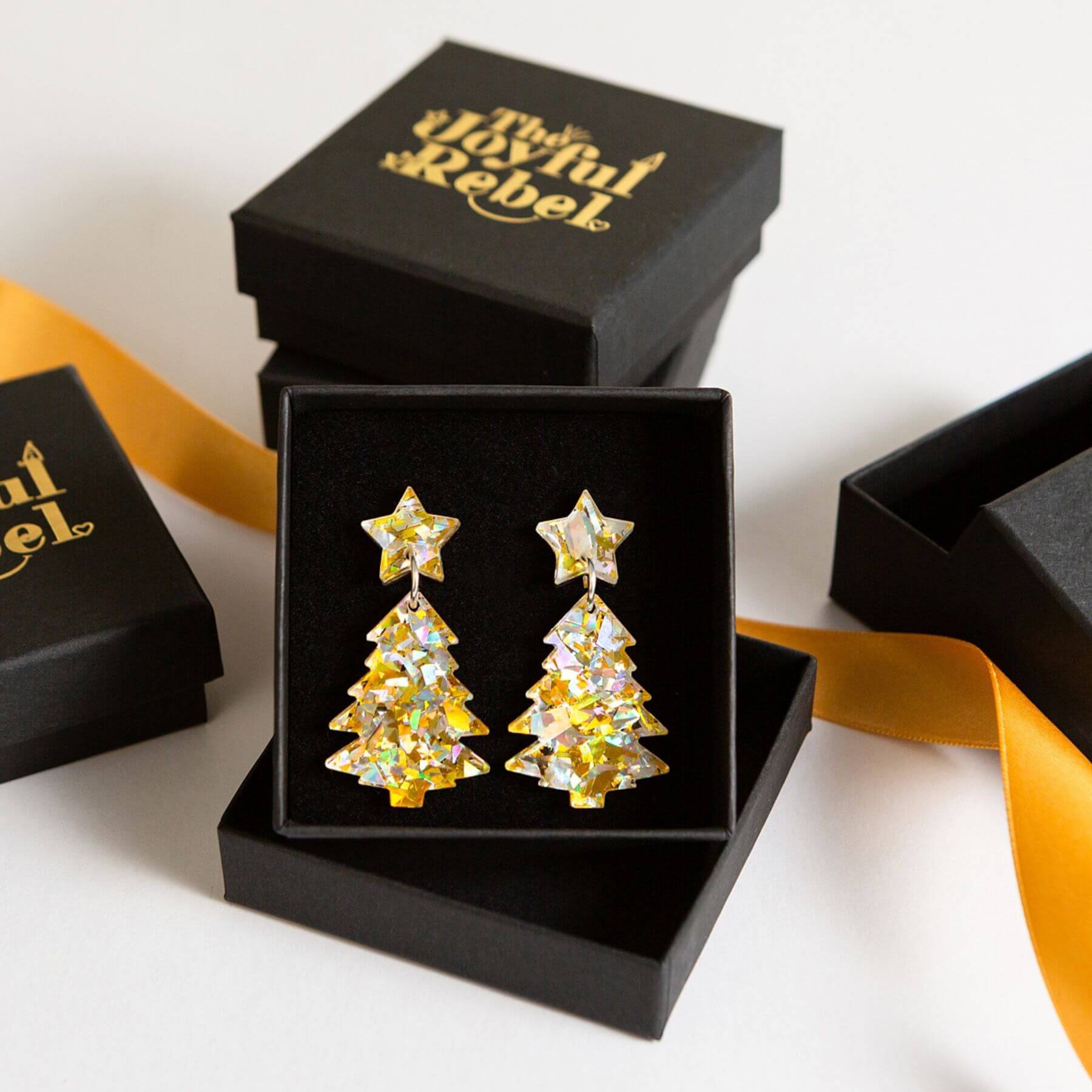 Christmas silver and gold Christmas tree earrings in a black jewellery gift box