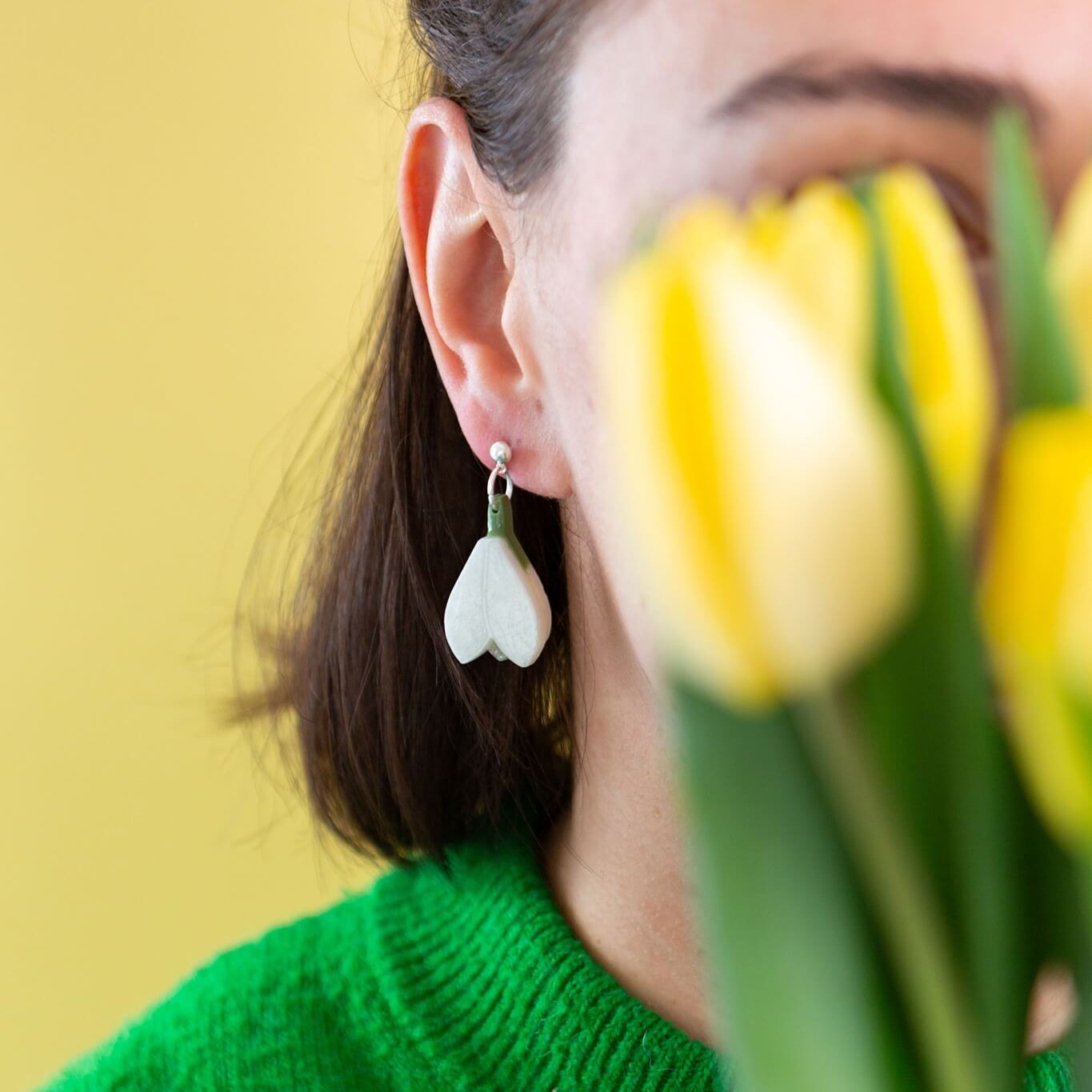 Model wearing the snowdrop earrings from the joyful rebel