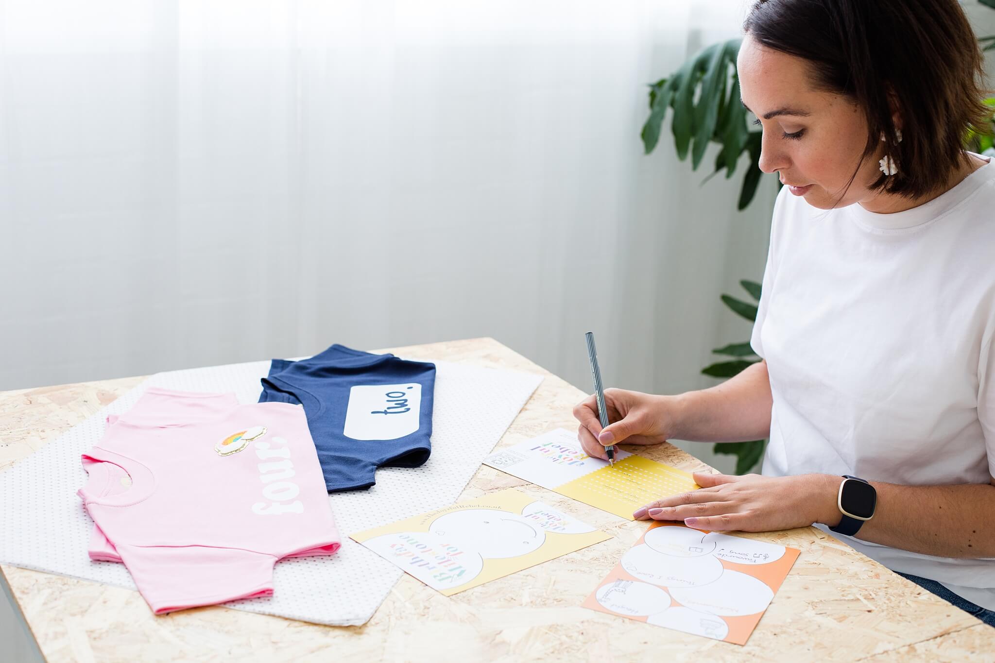 Designer of The Joyful Rebel filling out a birthday message for an order. Making it the perfect birthday gift sent straight to recipient.