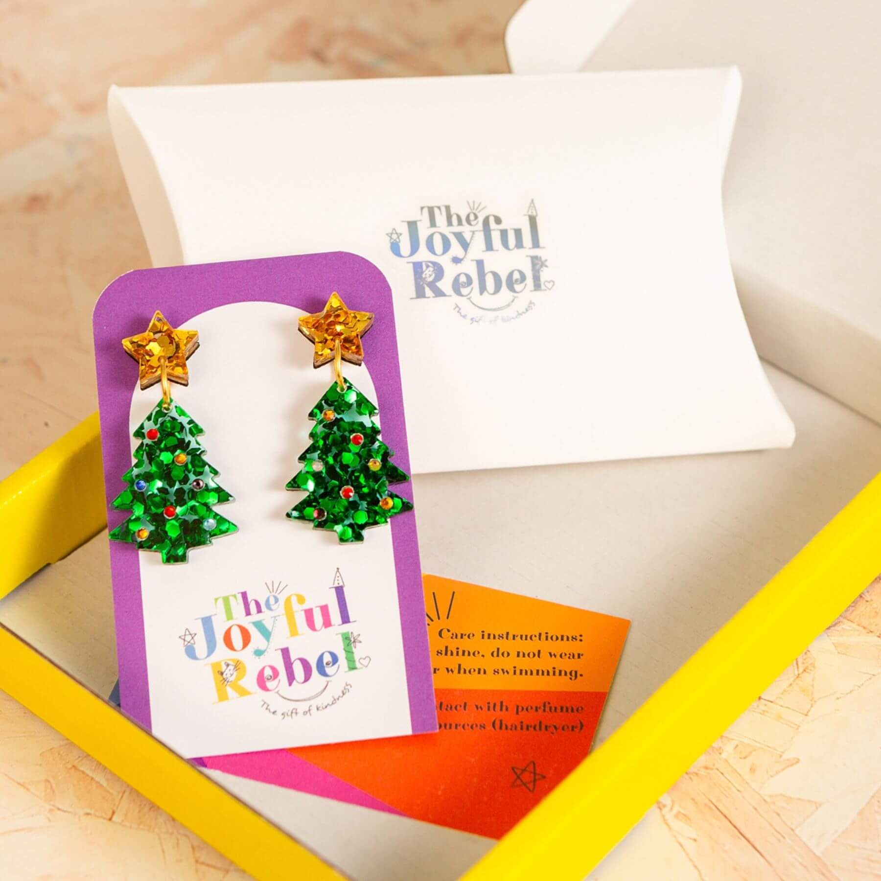 Handmade Christmas tree earrings on a jewellery card