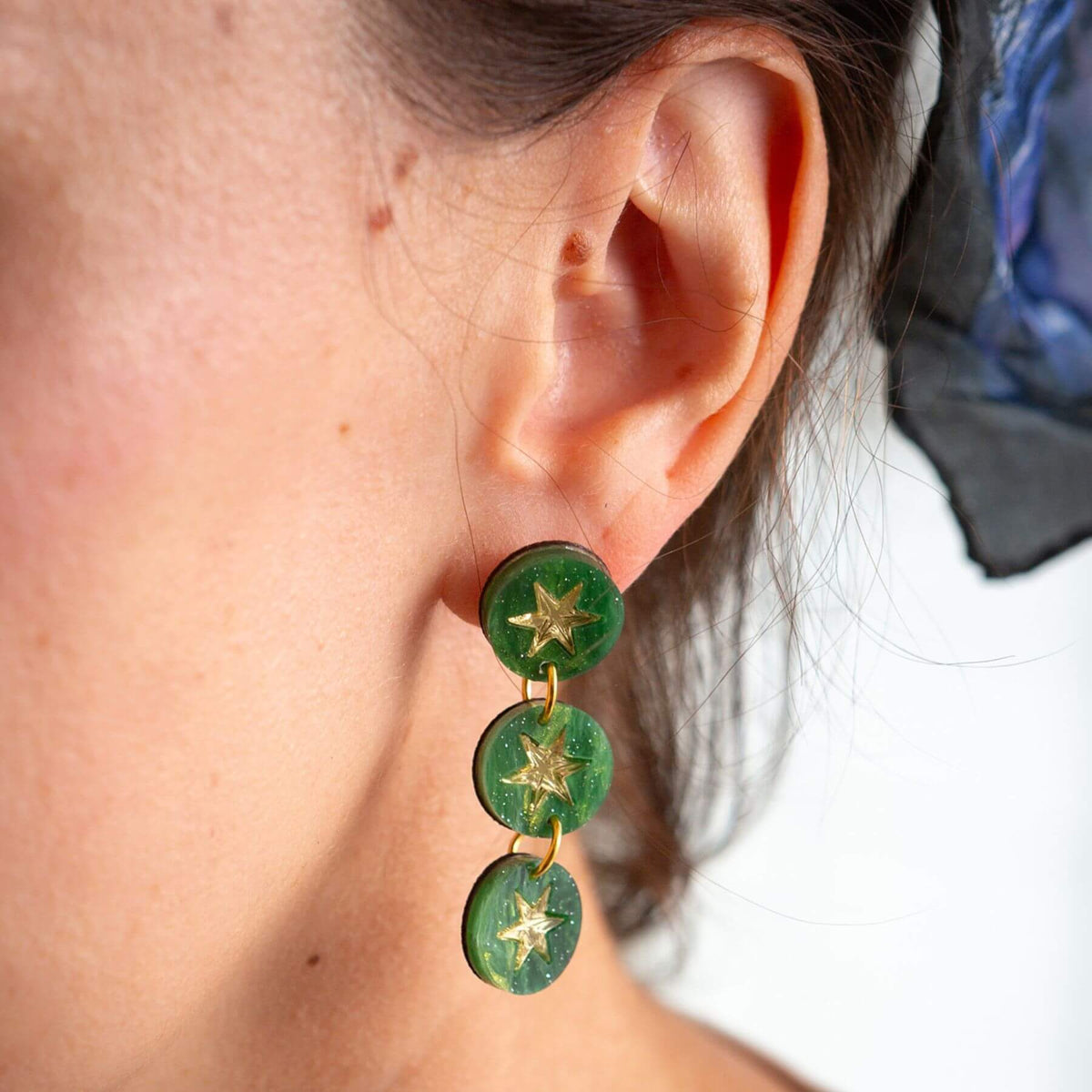 Handmade green marble triple drop earrings worn as statement jewellery