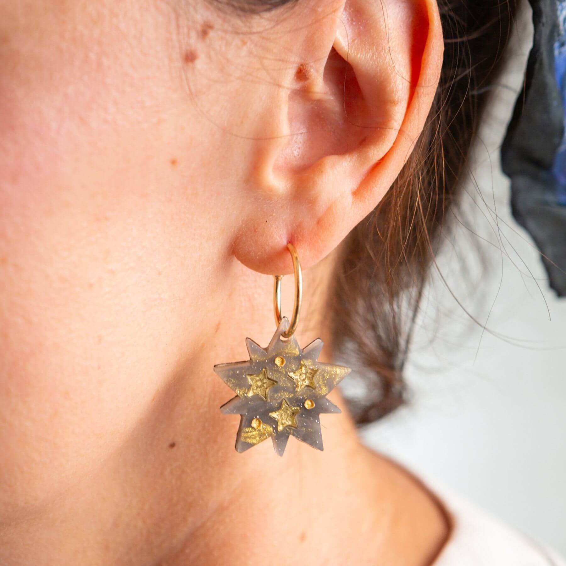 Celestial star hoop earrings worn as handmade statement jewellery