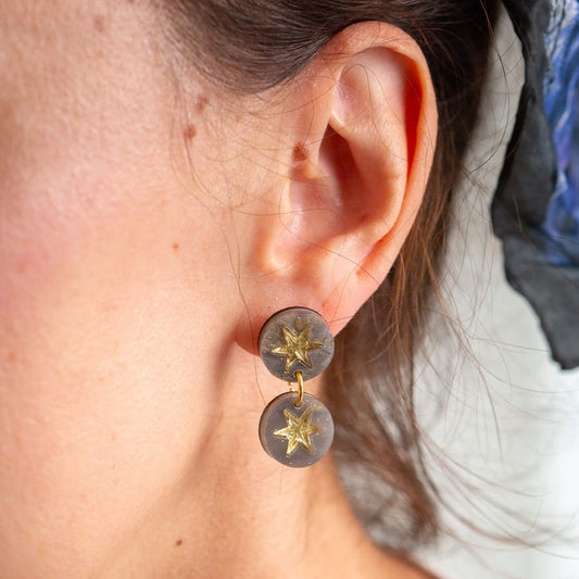 Handmade grey marble triple drop earrings worn as statement jewellery