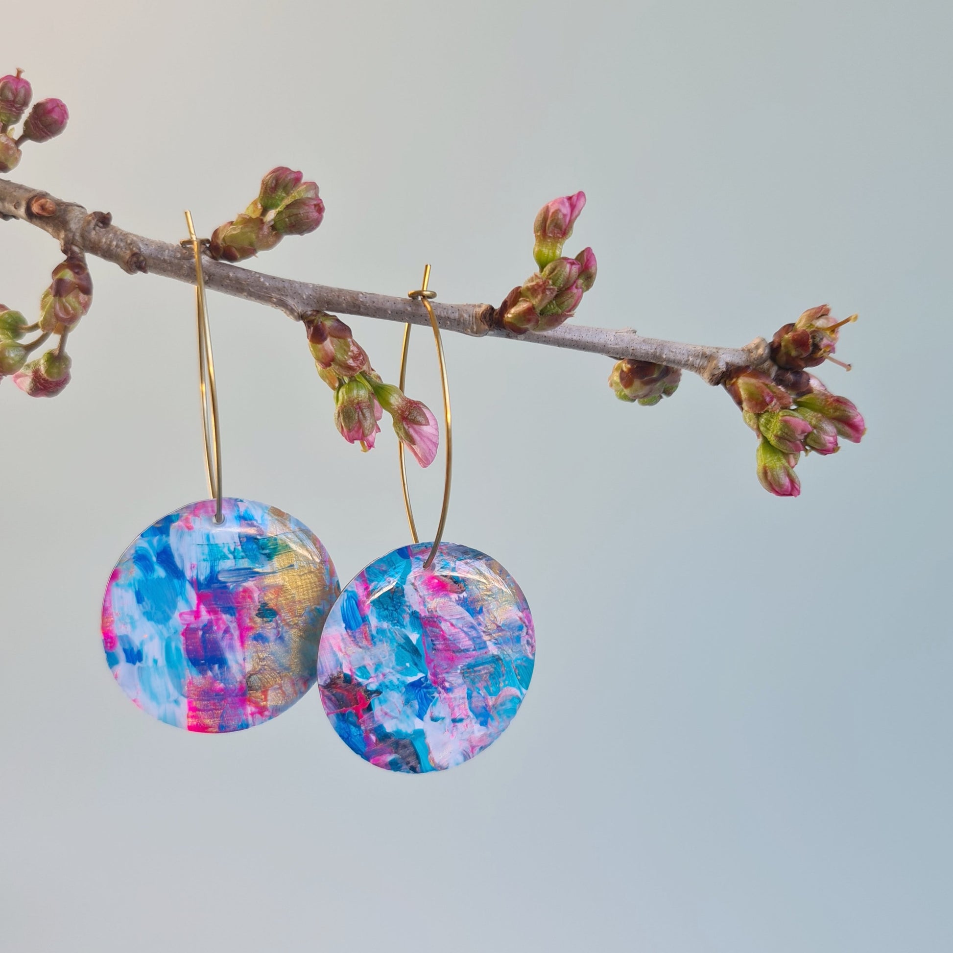 Dangly earrings from The Joyful Rebel - hand painted resin with oval brass ear wire.