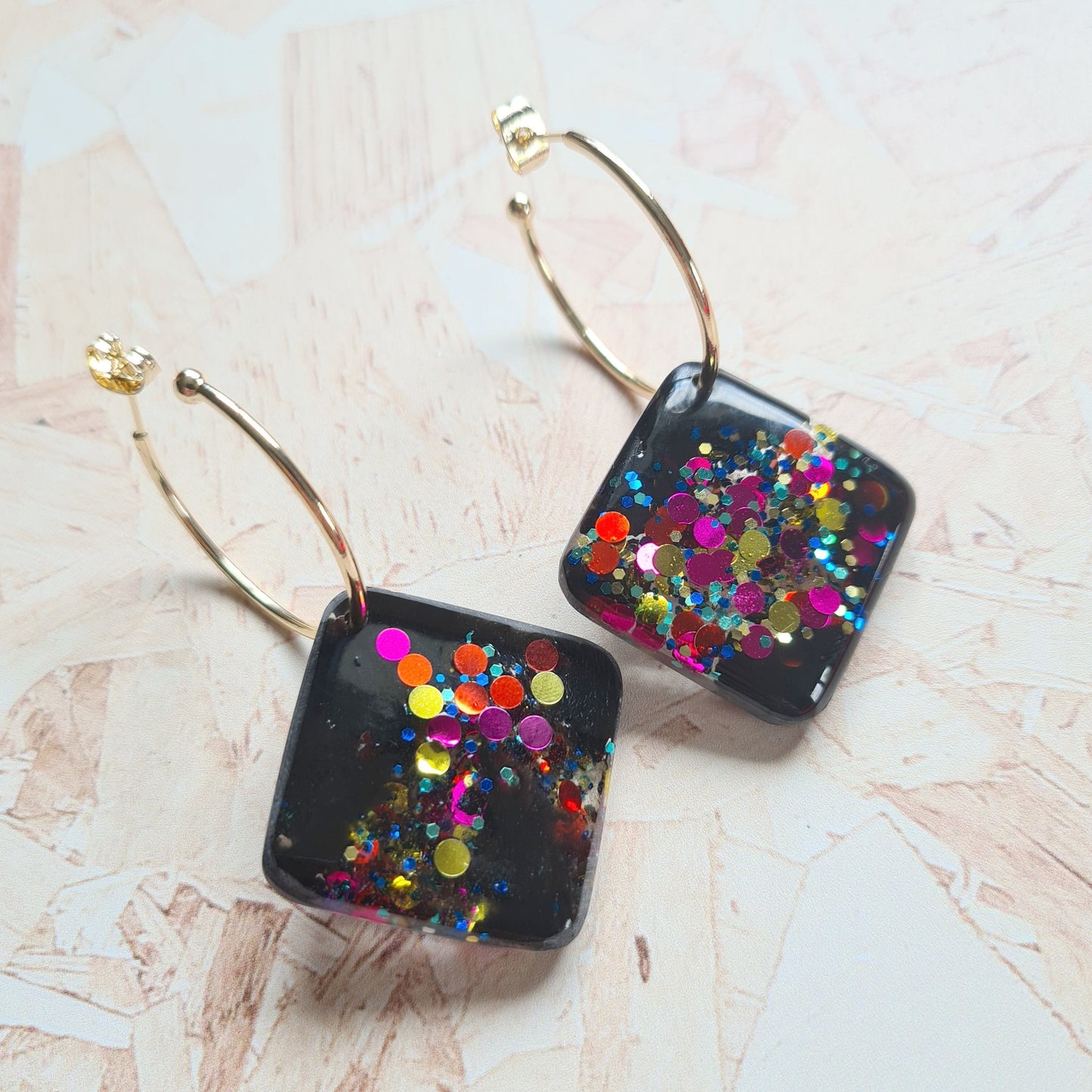 Solid resin earring with gold plated hoops - the joyful rebel