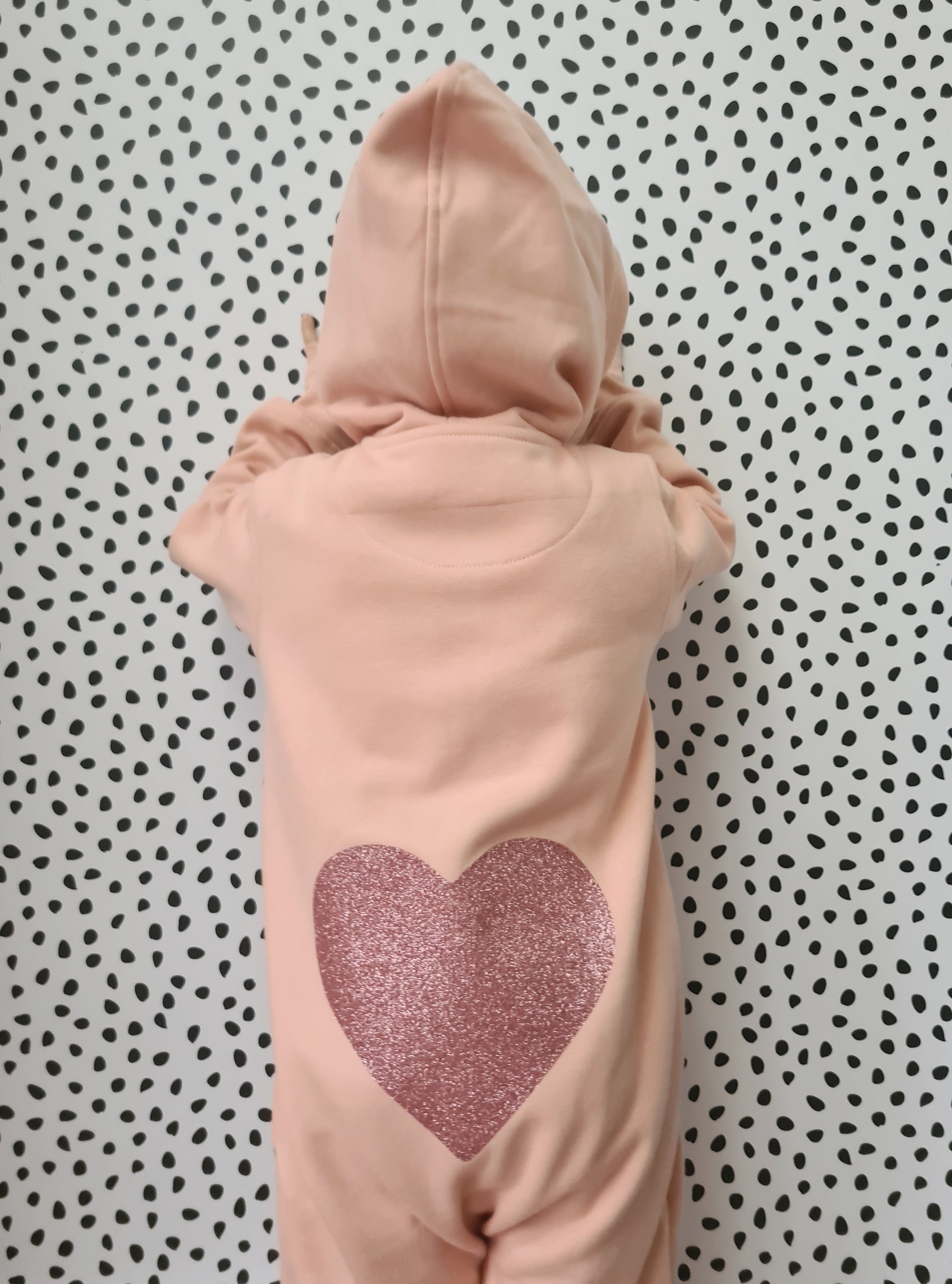 Blush fleece onesie suit with heart of the back