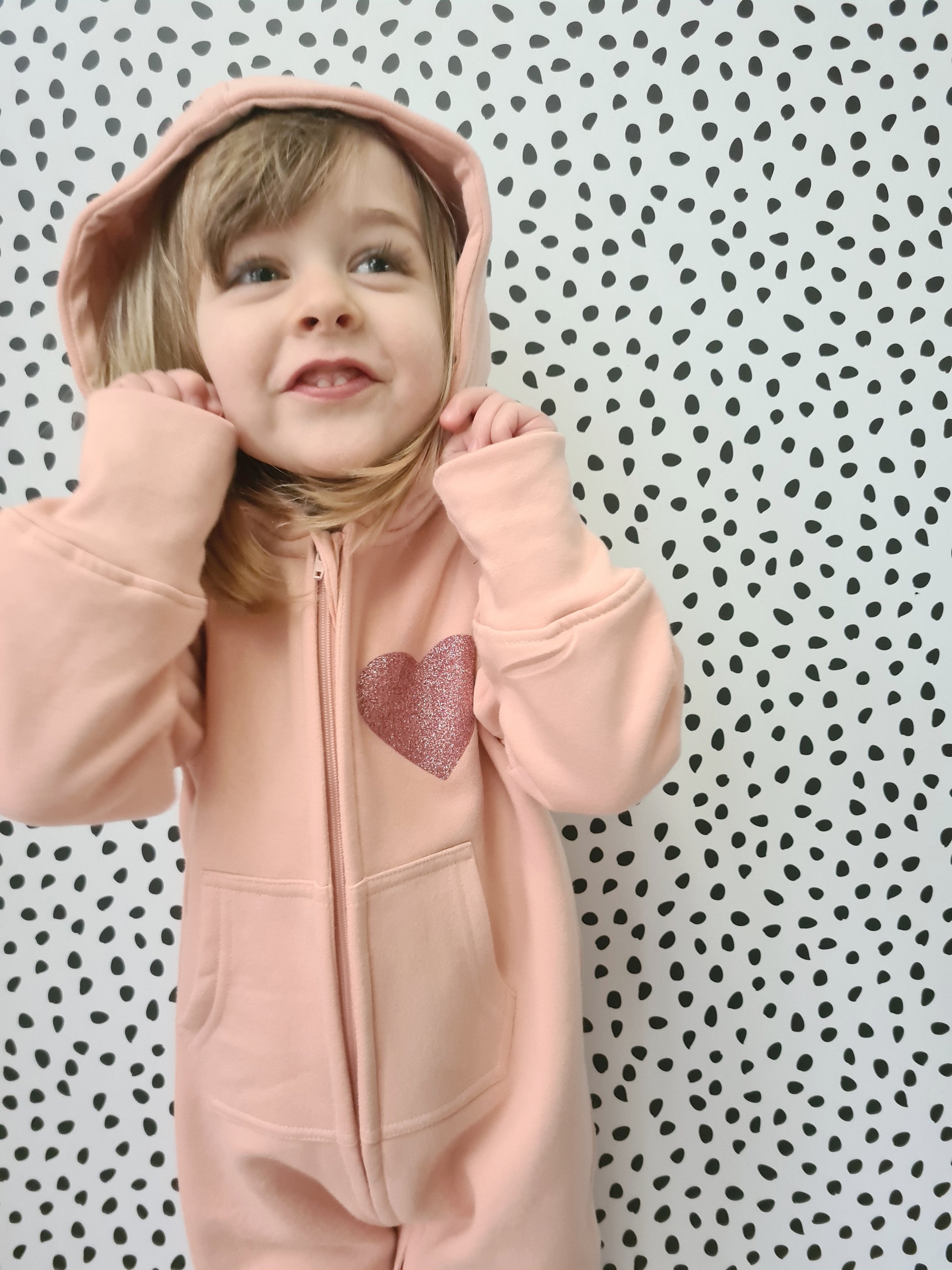 pink suit with hood up